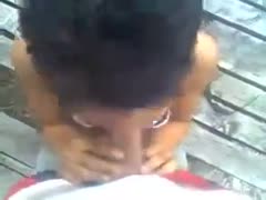 On a point-of-view camera, a brunette amateur swallows a big wang while standing on her knees.